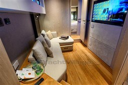 Manufacturer Provided Image: Luxurious interior of 2025 SACS Rebel 55 OB yacht with modern seating and entertainment system.