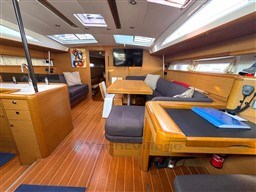 Spacious interior of 2011 Jeanneau 53 yacht with modern furnishings and ample natural light.