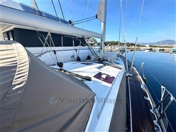2011 Jeanneau 53 sailboat docked in a marina, showcasing deck and rigging.