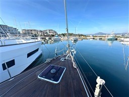 Jeanneau 53 yacht docked in a serene marina, 2011 model.