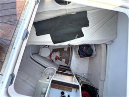 Interior view of 2011 Jeanneau 53 sailboat cabin with toilet and storage.