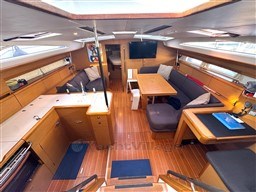 Luxurious interior of a 2011 Jeanneau 53 yacht with spacious seating and modern amenities.