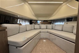 Luxurious interior of 2023 Invictus TT 420 yacht with spacious seating area.