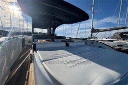 2023 Invictus TT 420 yacht with sleek design, docked under a sunny sky.