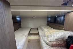 2023 Invictus TT 420 cabin interior with twin beds and modern design.