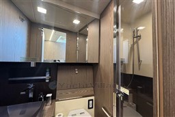 Luxurious bathroom interior of 2023 Invictus TT 420 yacht, featuring modern fixtures and elegant design.