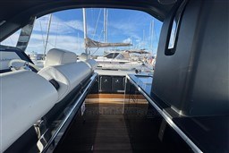 2023 Invictus TT 420 yacht interior with sleek design and luxurious seating.