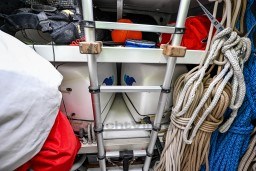 Storage area on 1978 Stain 70 Gulet with ladder, ropes, and equipment.