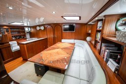 Luxurious interior of 1978 Stain 70 Gulet yacht with wood paneling and modern amenities.