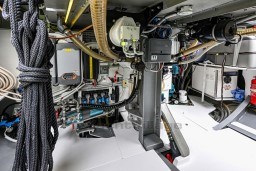 Engine room of 1978 Stain 70 Gulet, showcasing complex machinery and equipment.