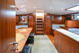 Interior of 1978 Stain 70 Gulet yacht with wooden furnishings and modern amenities.