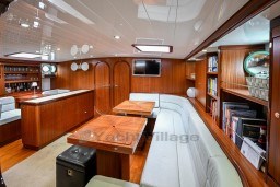 Luxurious interior of 1978 Stain 70 Gulet yacht with wood paneling and modern amenities.