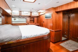 Luxurious wooden cabin interior of 1978 Stain 70 Gulet yacht with modern amenities.