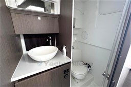 2024 Beneteau Flyer 9 SUNdeck bathroom with modern sink and toilet.
