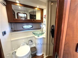 Luxurious bathroom in 2006 Sunseeker Portofino 53 yacht with modern fixtures and wood accents.