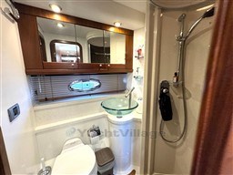 Luxurious bathroom in 2006 Sunseeker Portofino 53 yacht with modern fixtures and elegant design.