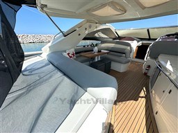 Luxurious 2006 Sunseeker Portofino 53 yacht interior with elegant seating and wooden deck.