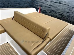 Luxurious seating on 2024 VanDutch 32 Diesel yacht, featuring tan upholstery and sleek design.