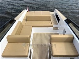 Luxurious seating on 2024 VanDutch 32 Diesel yacht, featuring beige cushions and sleek design.