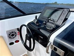 2024 VanDutch 32 Diesel yacht helm with modern controls and navigation display.