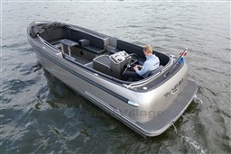 2020 Seafury Hawker 725 boat cruising on water with a person at the helm.