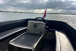 Seafury Hawker 725 boat interior with steering wheel, lake view, and flag, 2020 model.