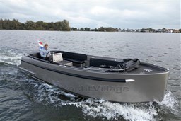 2020 Seafury Hawker 725 boat cruising on a lake with a person steering.