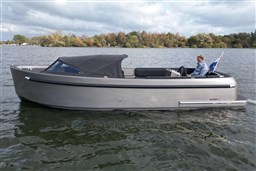 Seafury Hawker 725 boat cruising on a lake, 2020 model, with a person steering.
