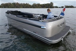 2020 Seafury Hawker 725 boat on water, with a person steering, Dutch flag visible.