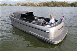 Seafury Hawker 725 boat cruising on a lake, 2020 model, with a person steering.