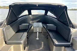 2020 Seafury Hawker 725 boat interior with cushioned seating and table on a lake.