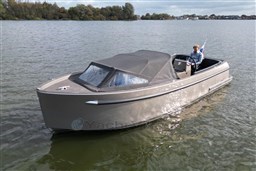 2020 Seafury Hawker 725 boat on a calm lake with a person steering.