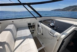 Cockpit of 2017 VanDutch 40 yacht with ocean view and modern controls.