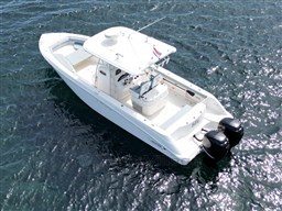 2005 Boston Whaler 320 Outrage boat on water, aerial view.