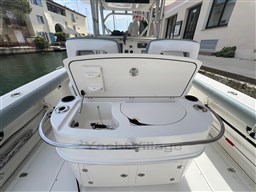 2005 Boston Whaler 320 Outrage boat interior with open storage compartment.