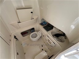 2005 Boston Whaler 320 Outrage boat interior with toilet and storage compartments.