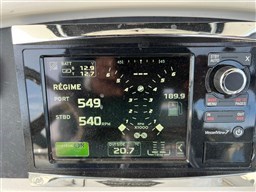 2005 Boston Whaler 320 Outrage dashboard display showing engine RPM and system status.