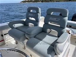 2005 Boston Whaler 320 Outrage boat seats with ocean view in background.