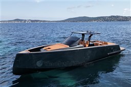 2022 Pardo Yachts P43 luxury yacht on serene blue waters with scenic coastal backdrop.