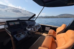 Luxurious 2022 Pardo Yachts P43 helm with leather seats and panoramic sea view.