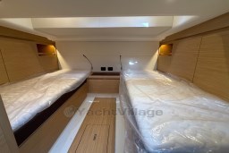 Interior cabin of 2022 Pardo Yachts P43 with twin beds and wooden finish.