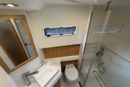 Modern bathroom in 2022 Pardo Yachts P43, featuring sleek fixtures and a glass shower.