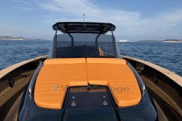 2022 Pardo Yachts P43 with orange sunbed, cruising on open sea.