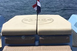 Luxury Wally 45 yacht deck with cushioned seating, 2004 model, on open water.