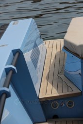Wally 45 yacht deck, 2004 model, featuring light blue exterior and wooden flooring.