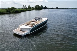 2023 Invictus GT 280 luxury boat on a serene lake.