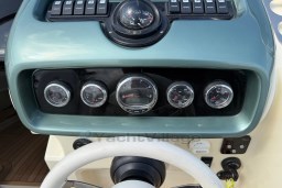 Dashboard of 2023 Invictus GT 280 boat with gauges and controls.