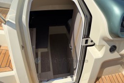 2023 Invictus GT 280 cabin entrance with wooden flooring and sleek interior design.