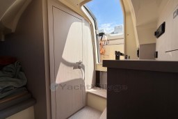 Interior view of 2023 Invictus GT 280 boat cabin with door and steps.