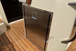 Stainless steel compartment on 2023 Invictus GT 280 boat with teak flooring.